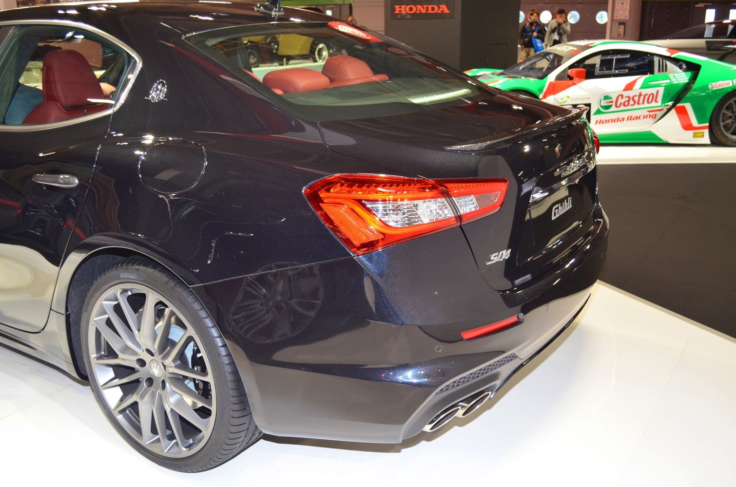 Rear view with distinctive taillights and quad exhaust tips