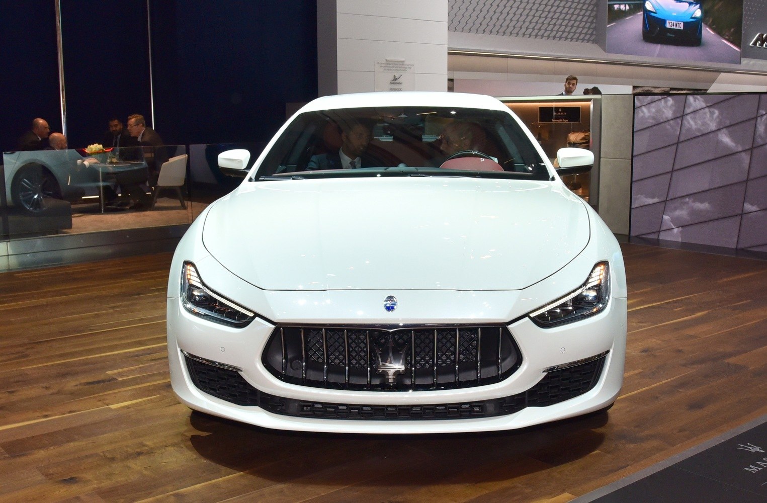 Luxury sedan front with vertical-bar grille and LED headlights