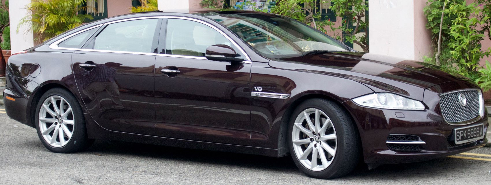 Luxury sedan with V8 badge and sleek aerodynamic design