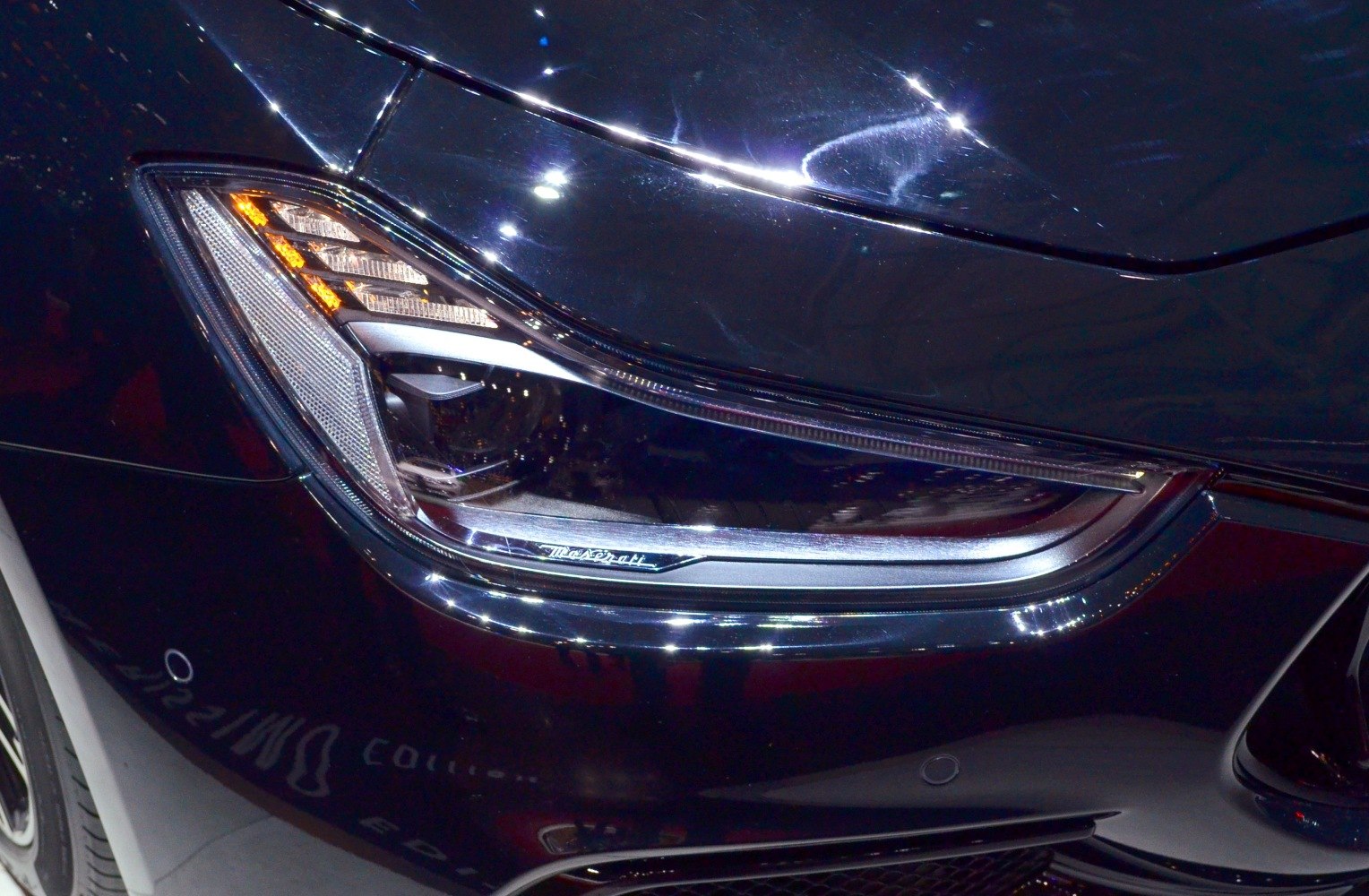 Close-up of sleek front headlight with detailed lighting elements