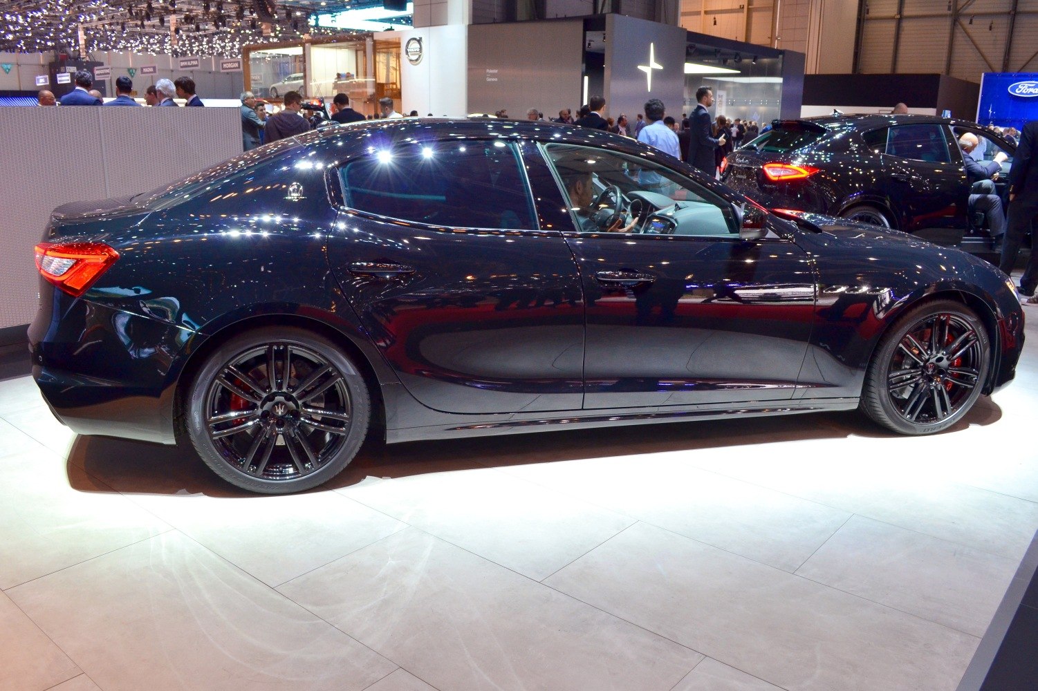 Side profile with black alloy wheels and tinted windows