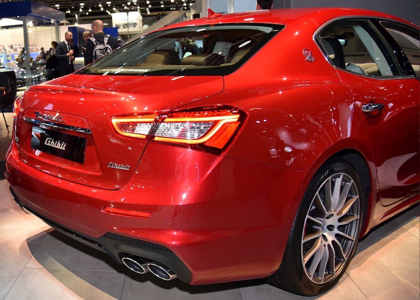 Luxury sedan rear with LED taillights and quad exhaust tips