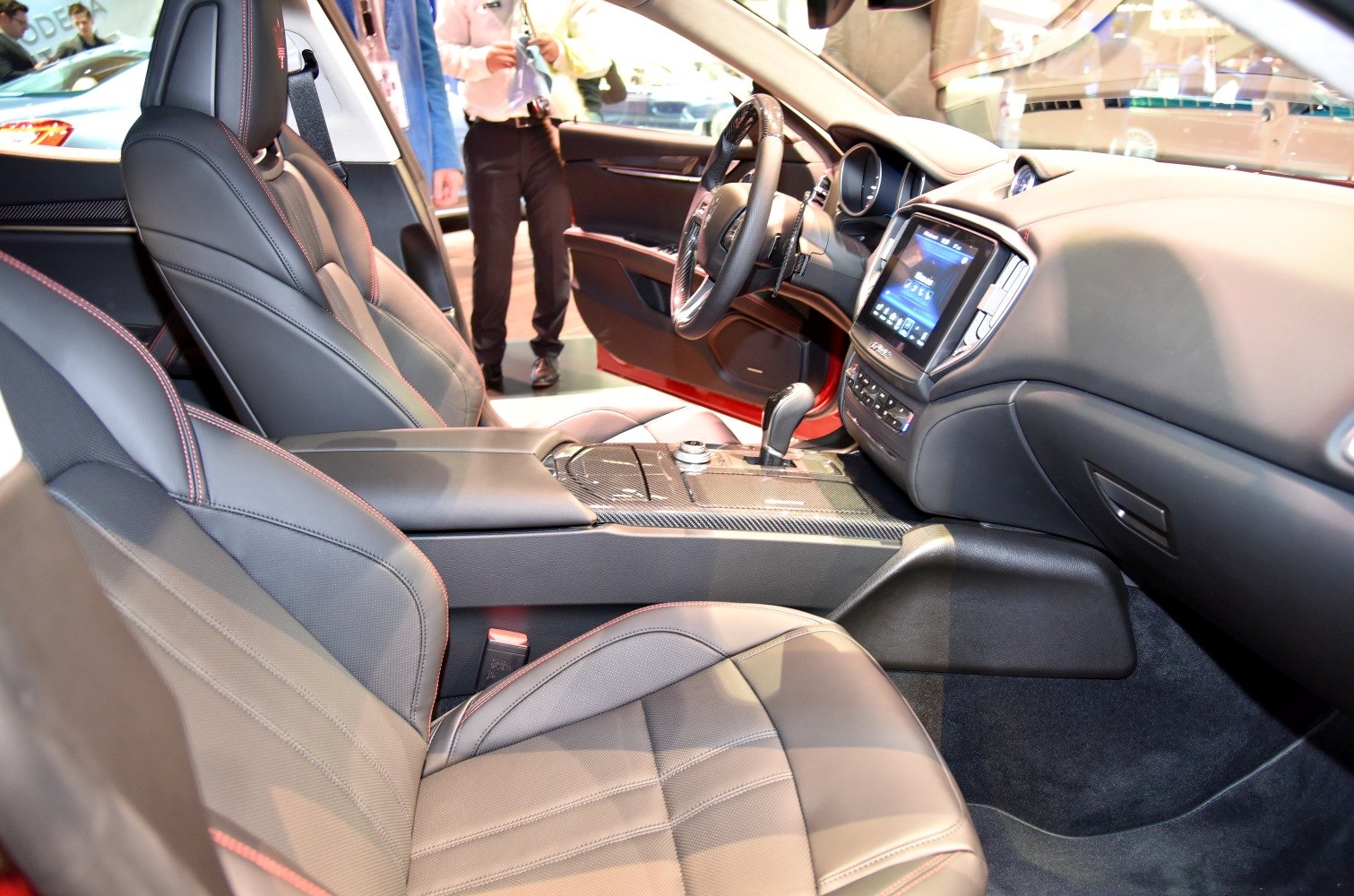 Sport leather seats with red stitching and digital touchscreen dashboard