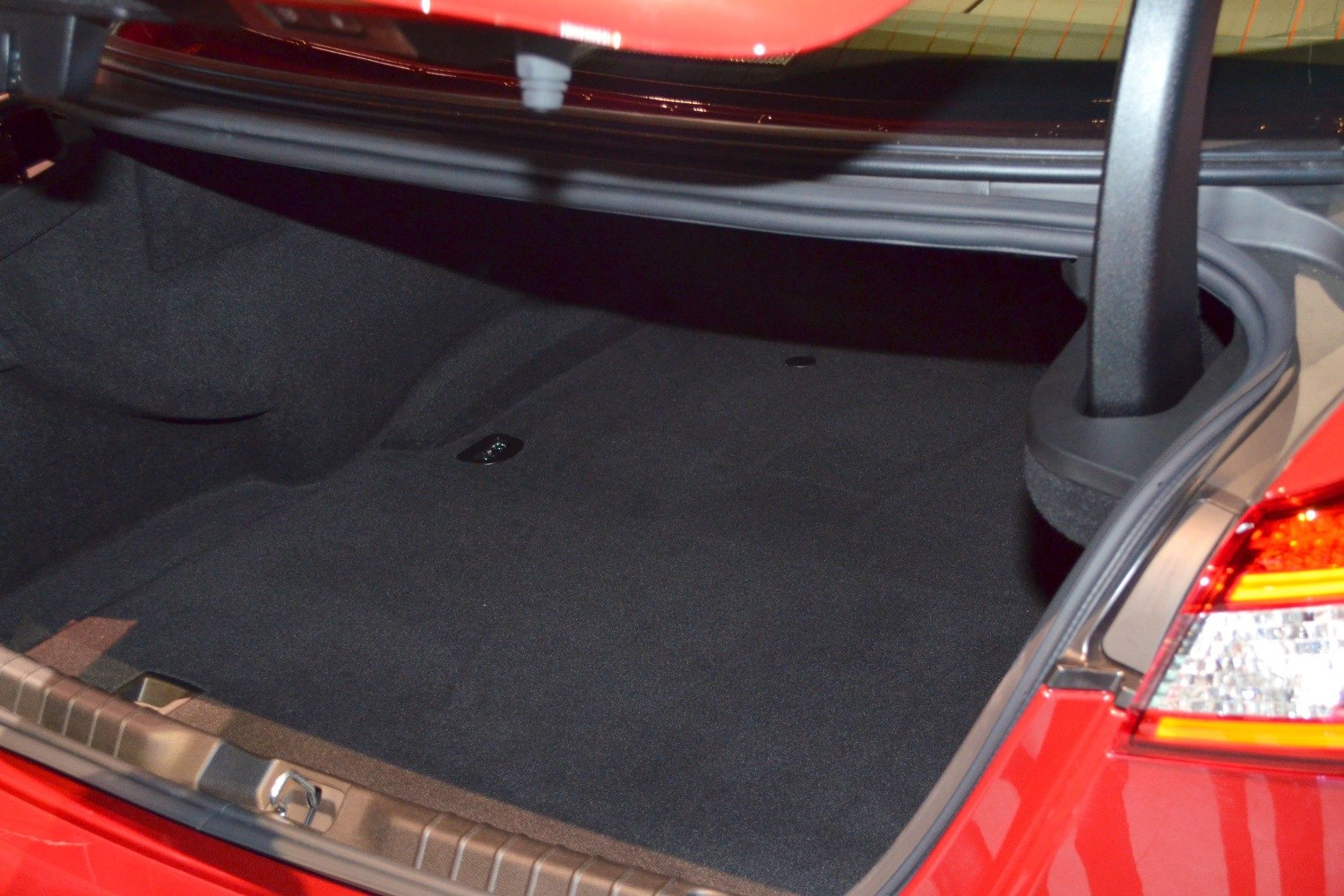 Spacious rear trunk with black interior lining and well-defined contours