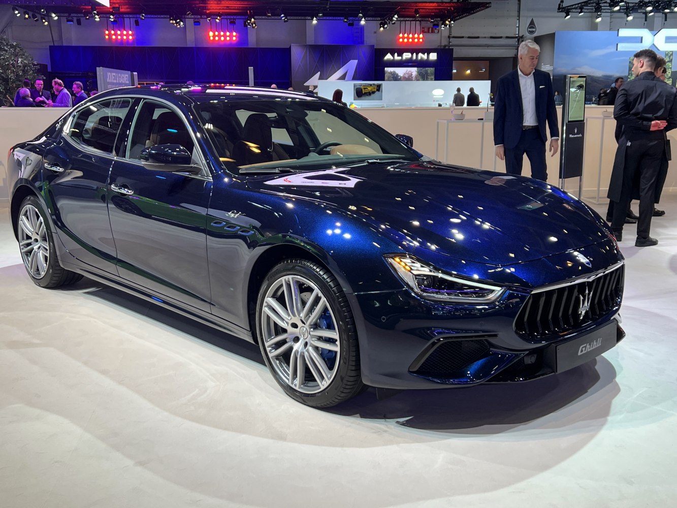 Front and side view of luxury sedan with distinctive grille and sporty alloy wheels