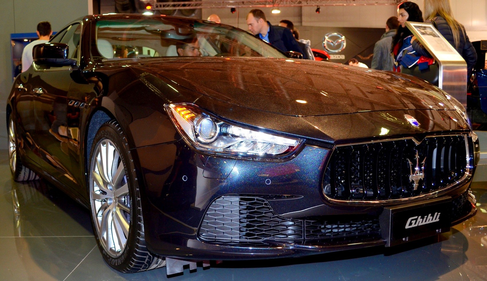 Close-up of luxury sedan front grille and LED headlight design