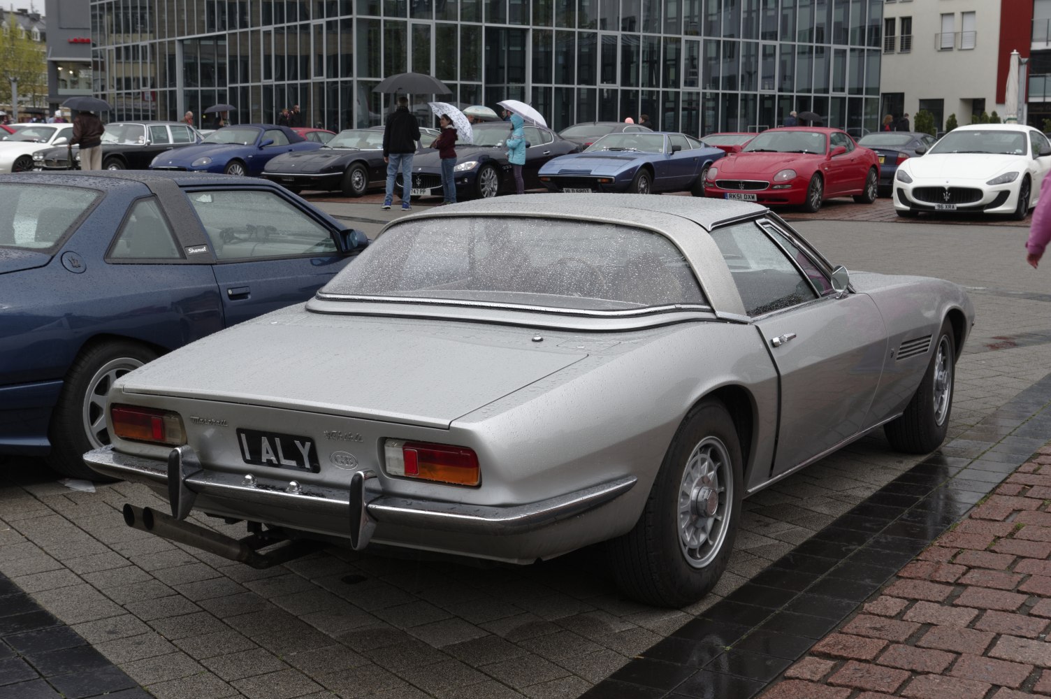 Classic convertible rear view with vintage alloy wheels and distinctive taillights