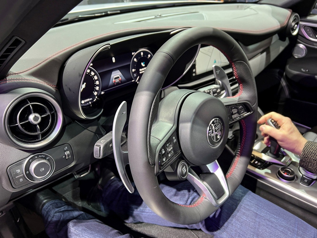 Steering wheel, digital instrument cluster, and center console with gear selector