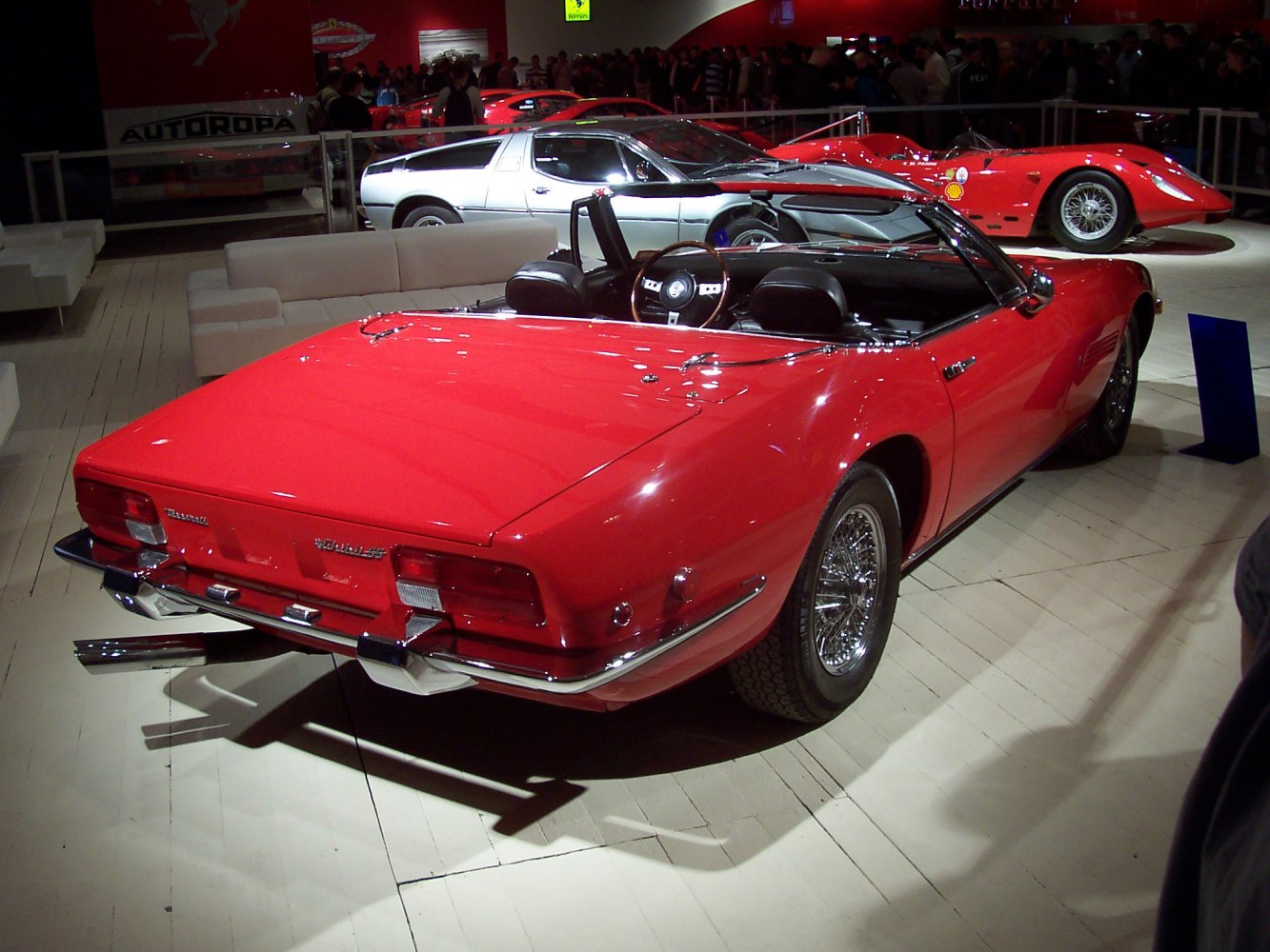 Red convertible with wire wheels and classic rear design
