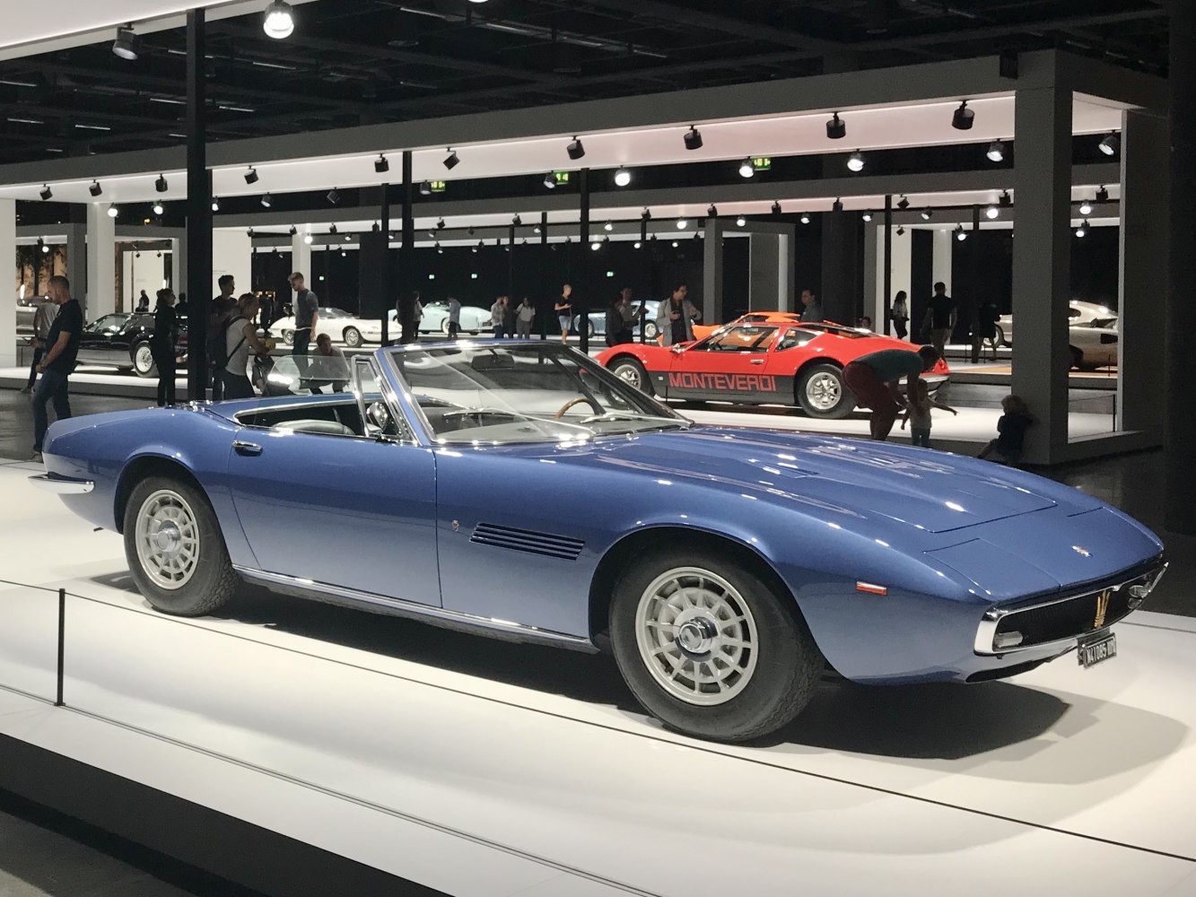 Classic 1969 convertible with long hood and wire-spoke wheels.