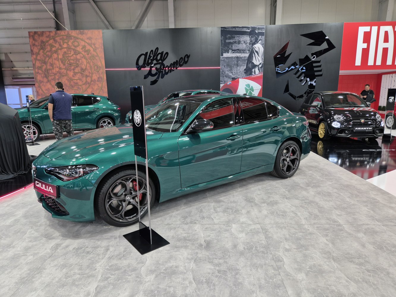 Green sedan with sporty design and unique wheel rims