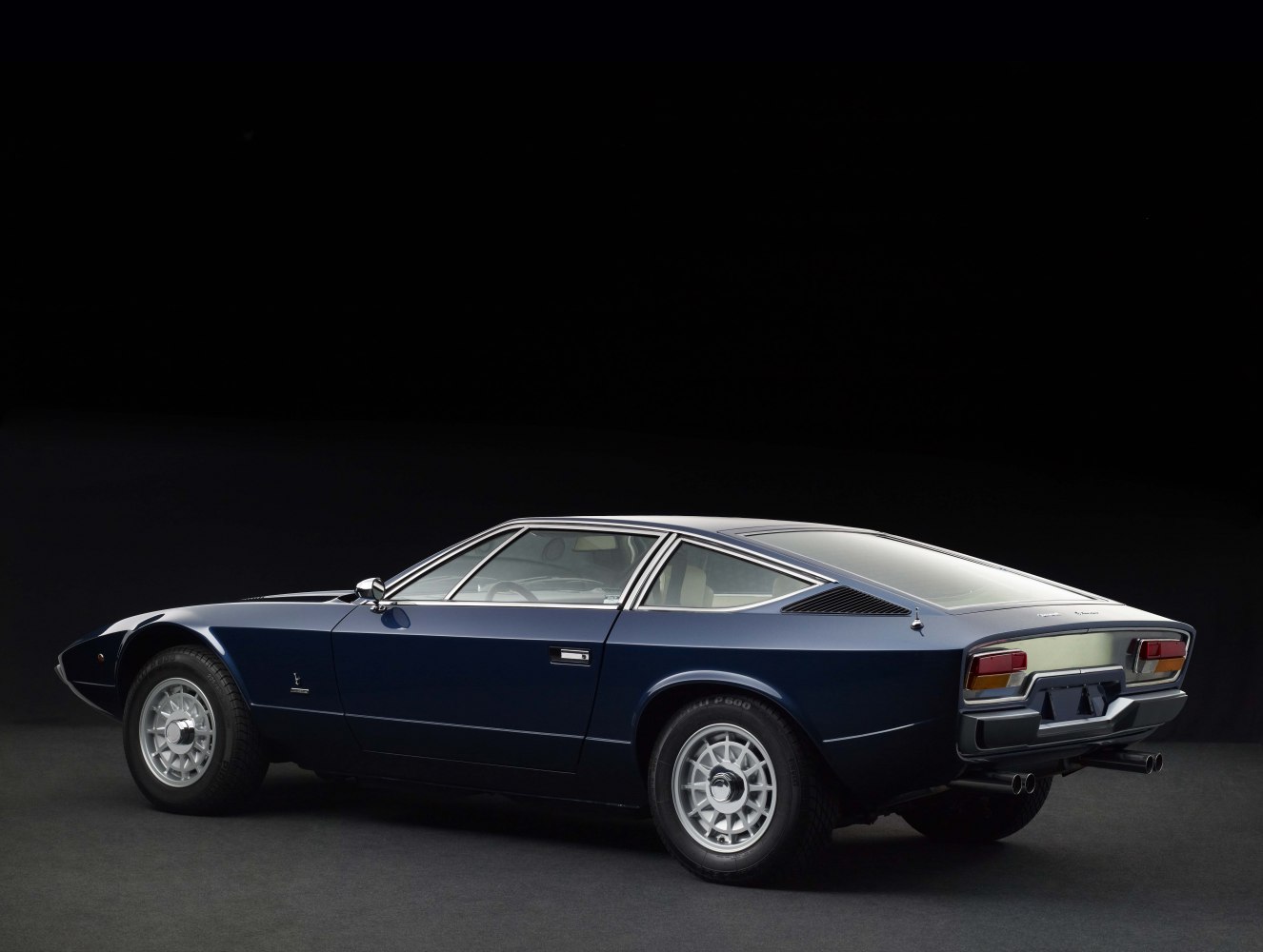 Sleek wedge side profile and distinctive rear design with dual exhausts