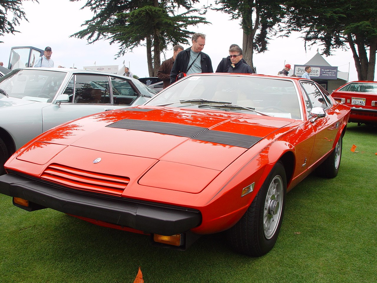 Red sports car with front vents and pop-up headlights