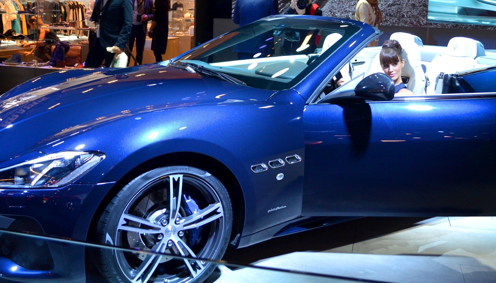 Convertible coupe front side with alloy wheels and blue exterior