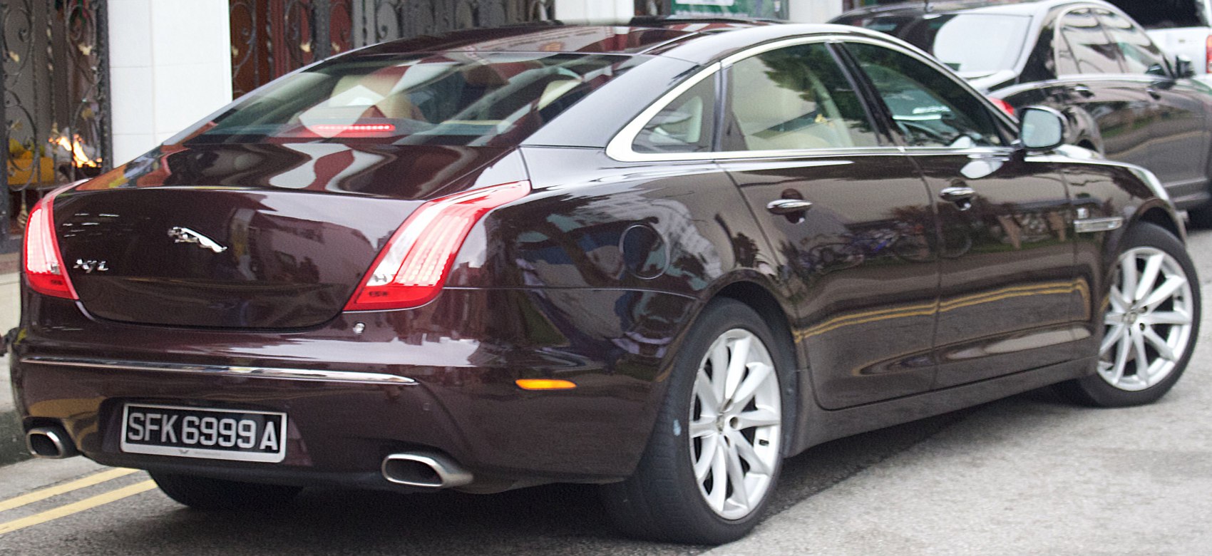 Rear view of luxury sedan with sleek tail lights and dual exhaust