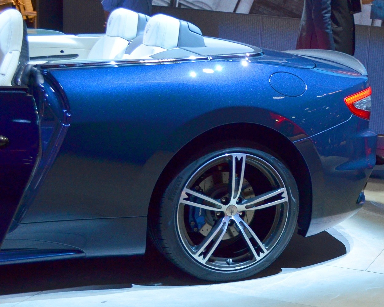 Rear quarter with open convertible interior and alloy wheel