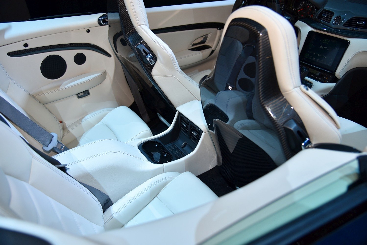 White leather seats with carbon fiber seat backs and center console.