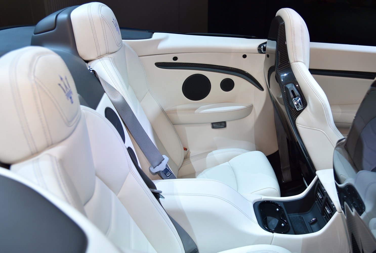 White leather seats with carbon fiber trim and interior door speakers