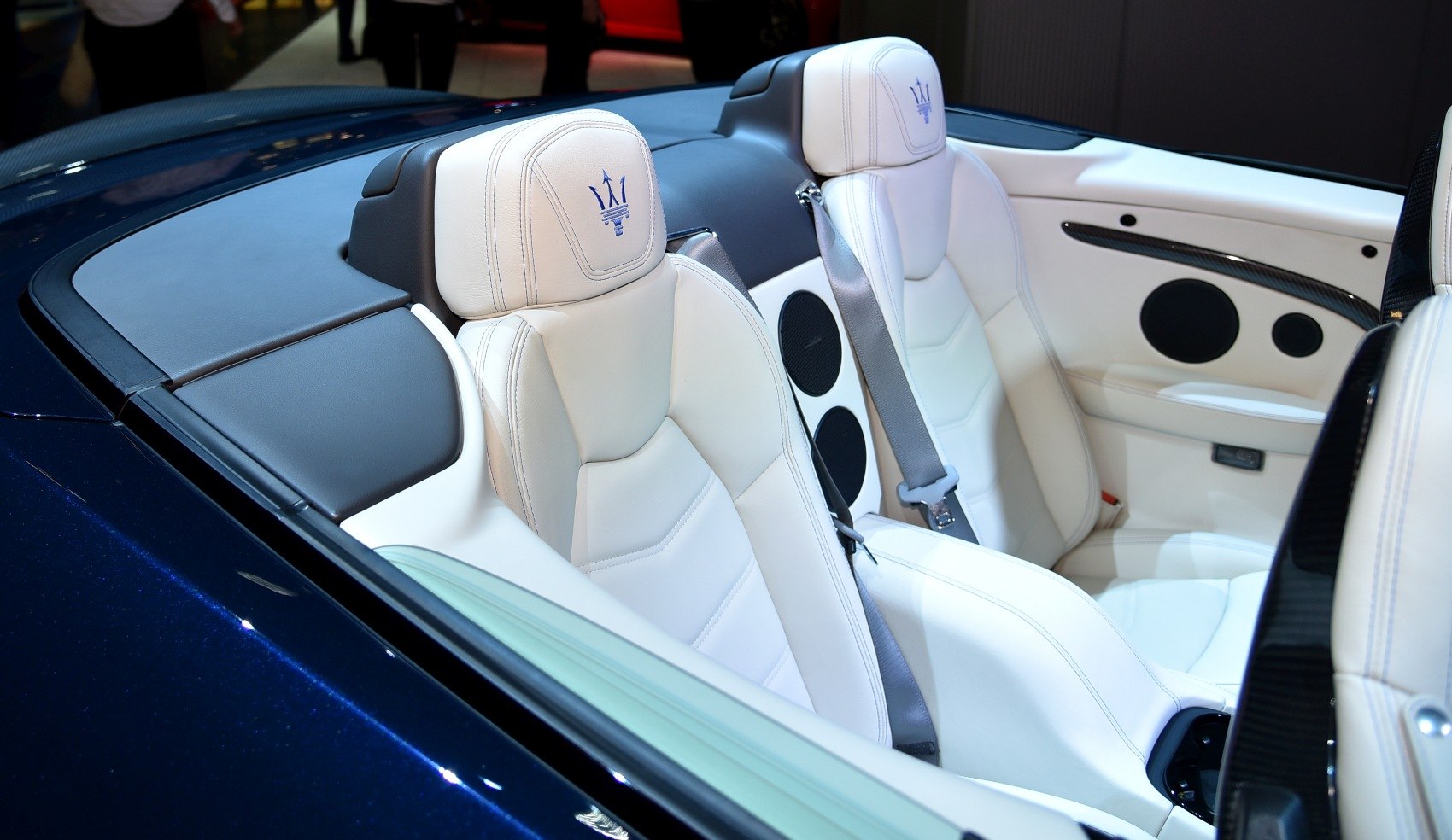 White leather luxury seats with blue logo and premium interior trim