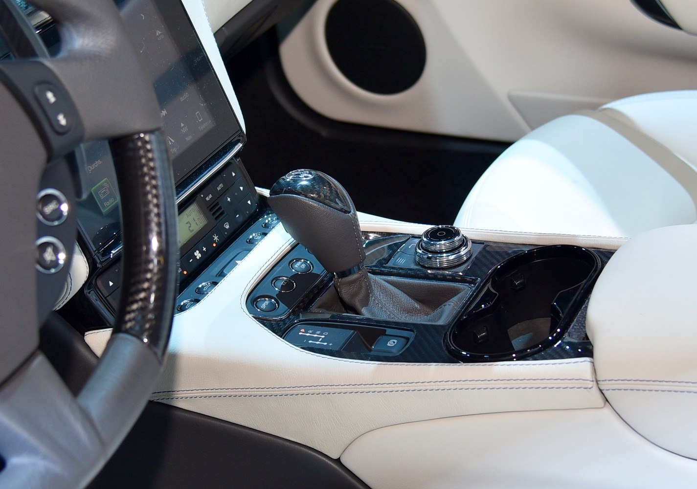 Luxury car interior center console with gear shift and control knob
