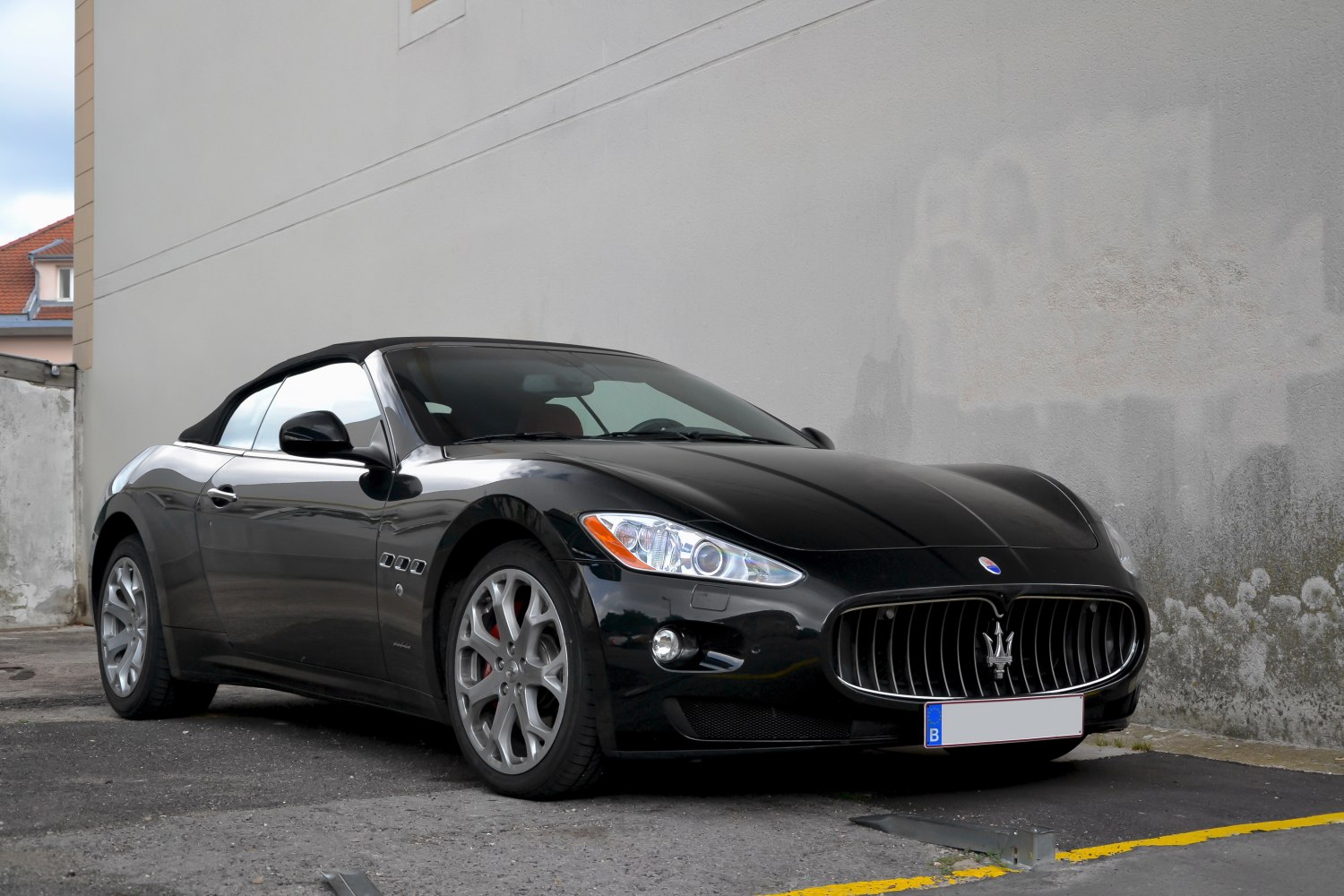 Convertible with prominent front grille and multi-spoke alloy wheels
