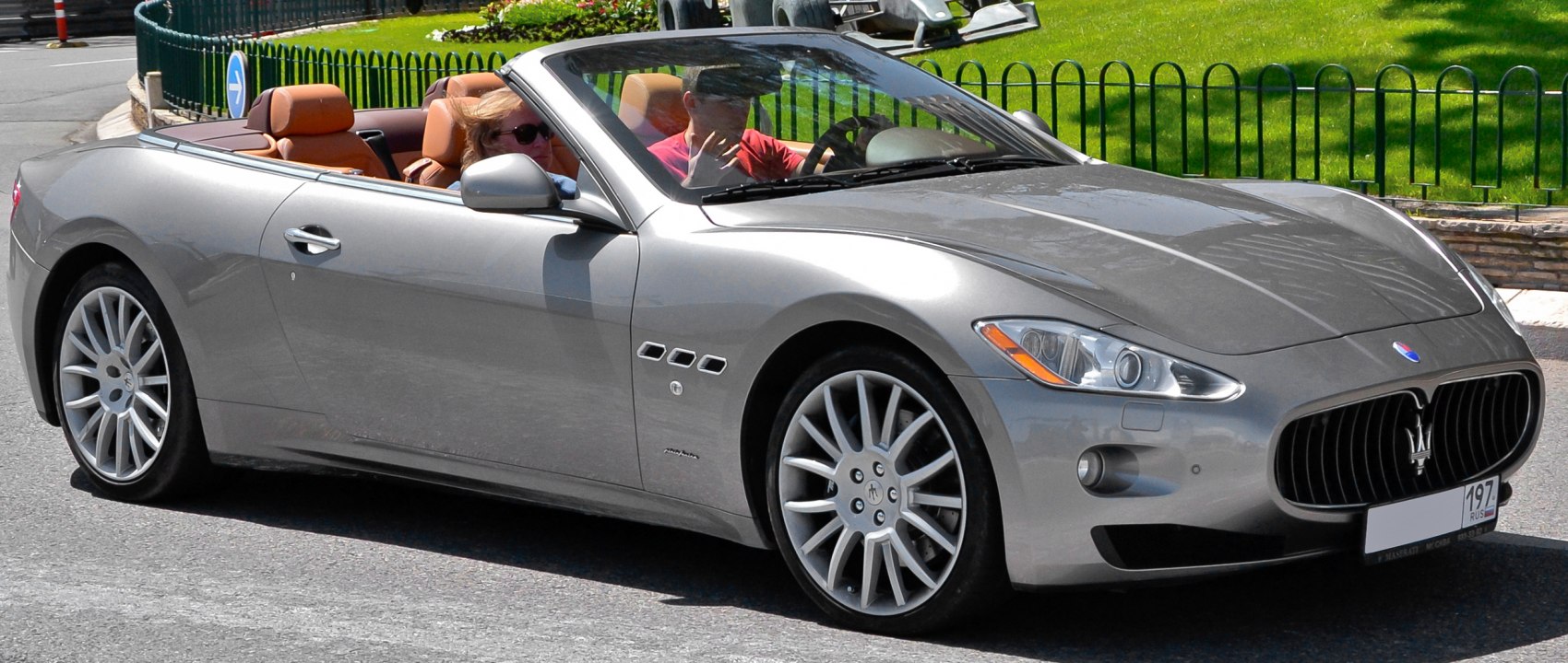 Luxury convertible with sleek silver body and leather interior