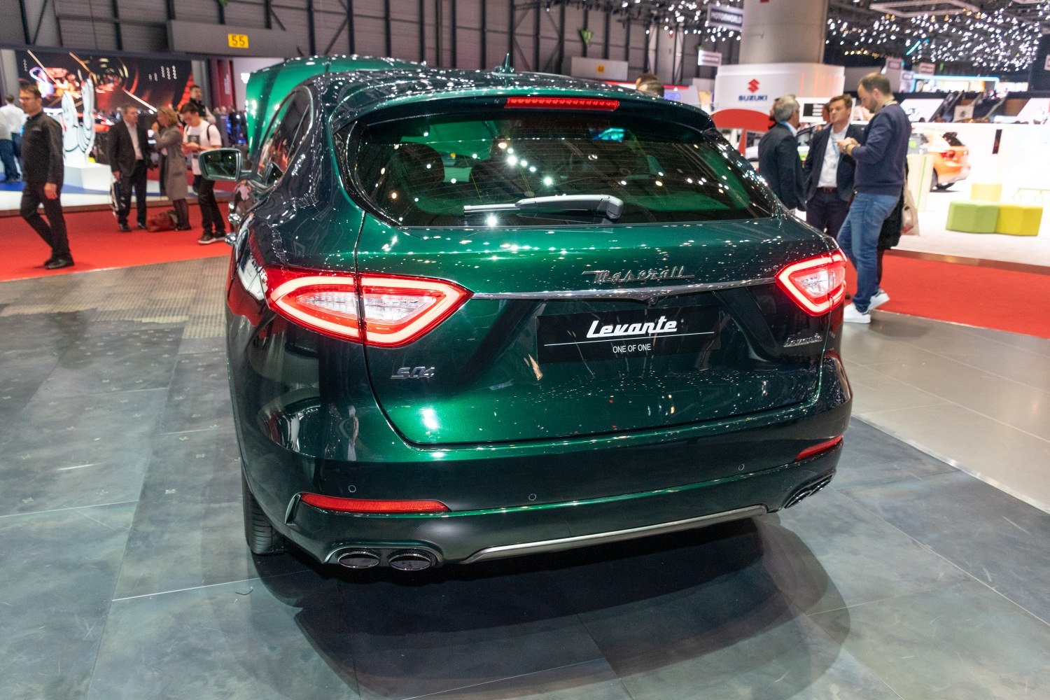 Rear view of luxury SUV with distinctive tail lights and quad exhaust