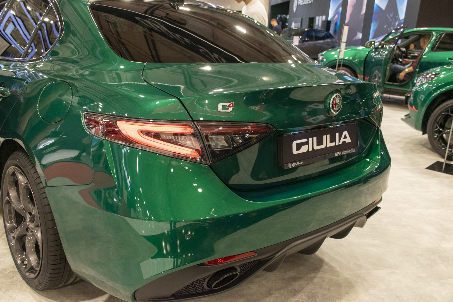 Rear view with taillights, rear bumper, and exhaust outlet