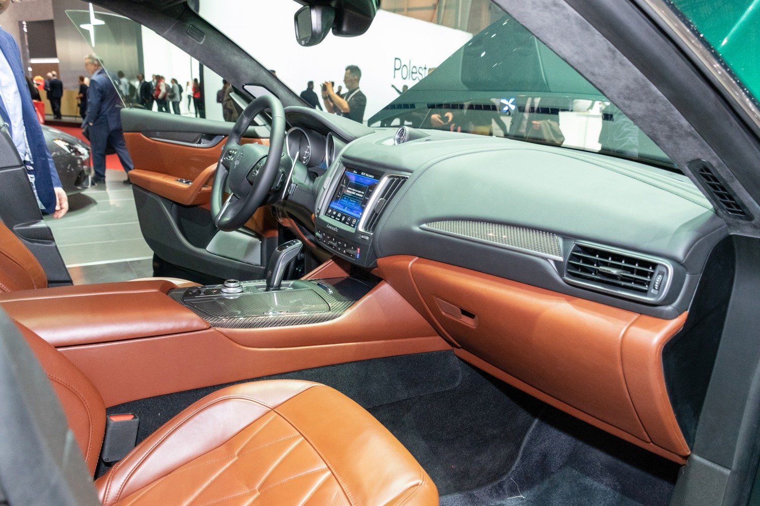 Luxury interior with brown leather seats and carbon fiber trim