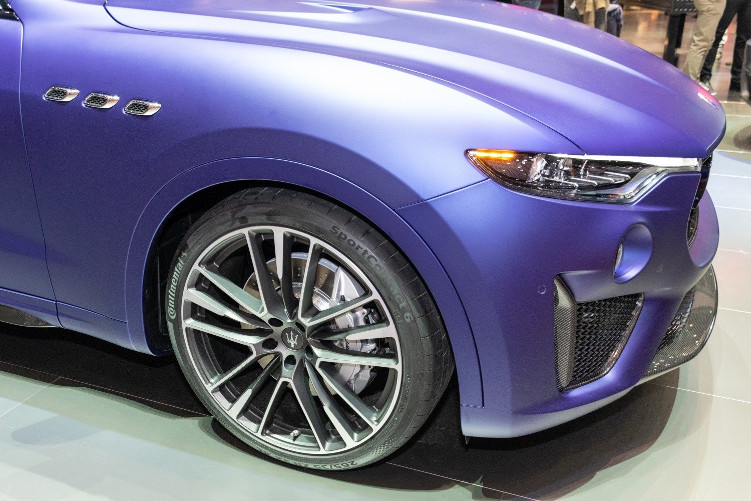 Front view of car with LED headlights, side vents, and multi-spoke alloy wheel