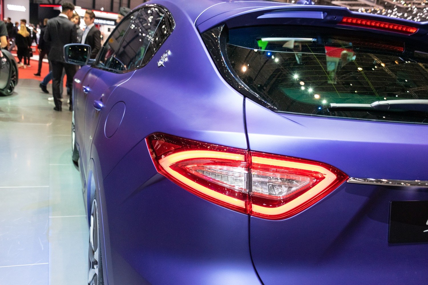 Close-up of rear LED tail light and side panel of luxury SUV