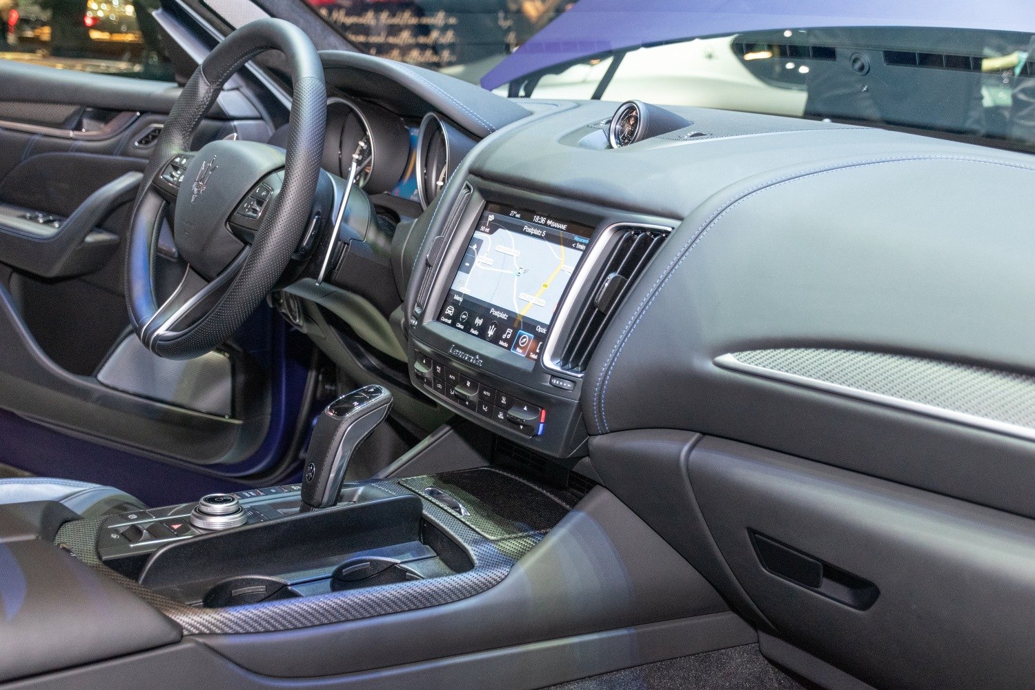Luxury leather dashboard and infotainment screen with steering wheel