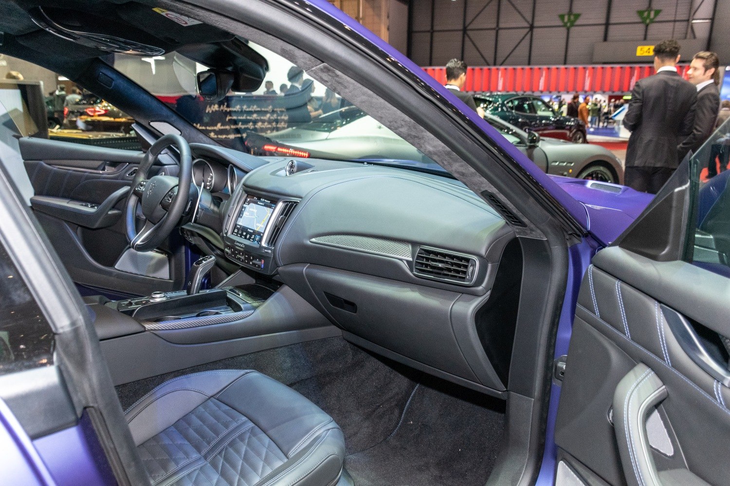 Luxury Maserati Levante interior with leather seats and modern dashboard.
