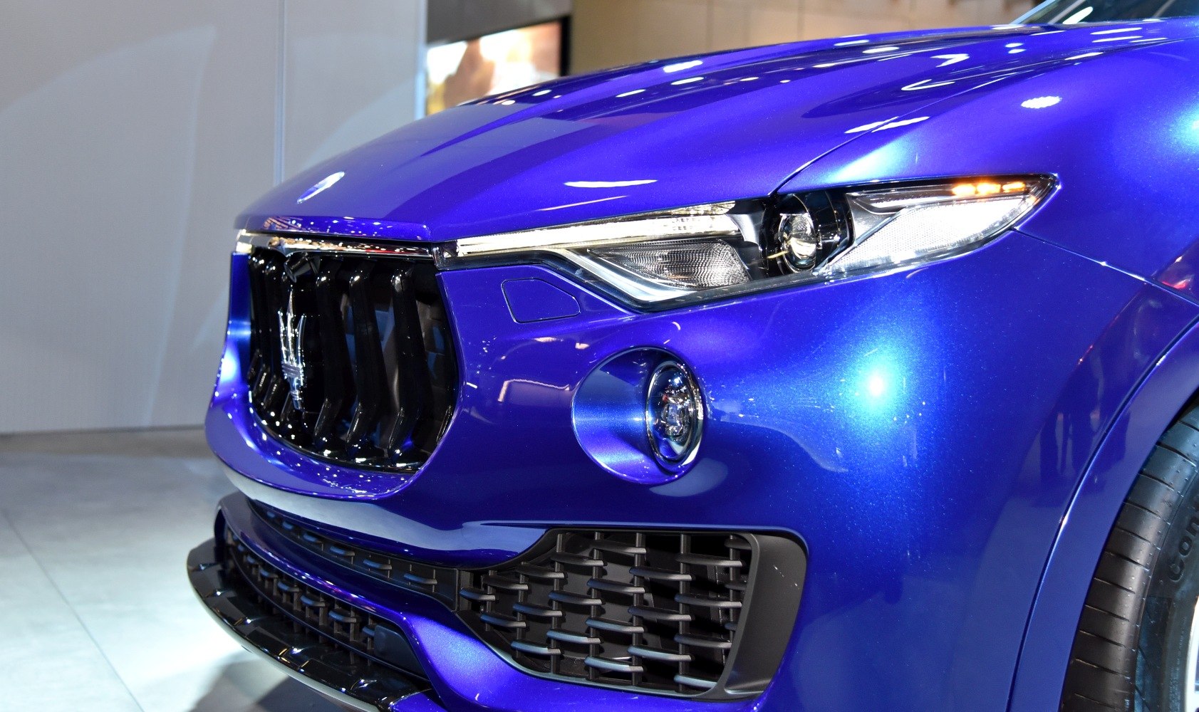 Close-up of front grille, headlight, and fog lamp design