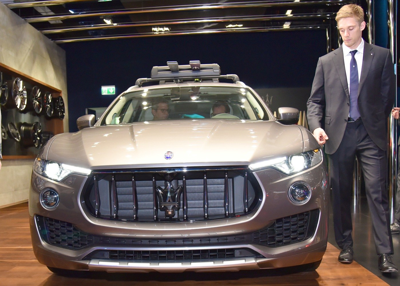 Front grille and headlights of luxury SUV with roof rack