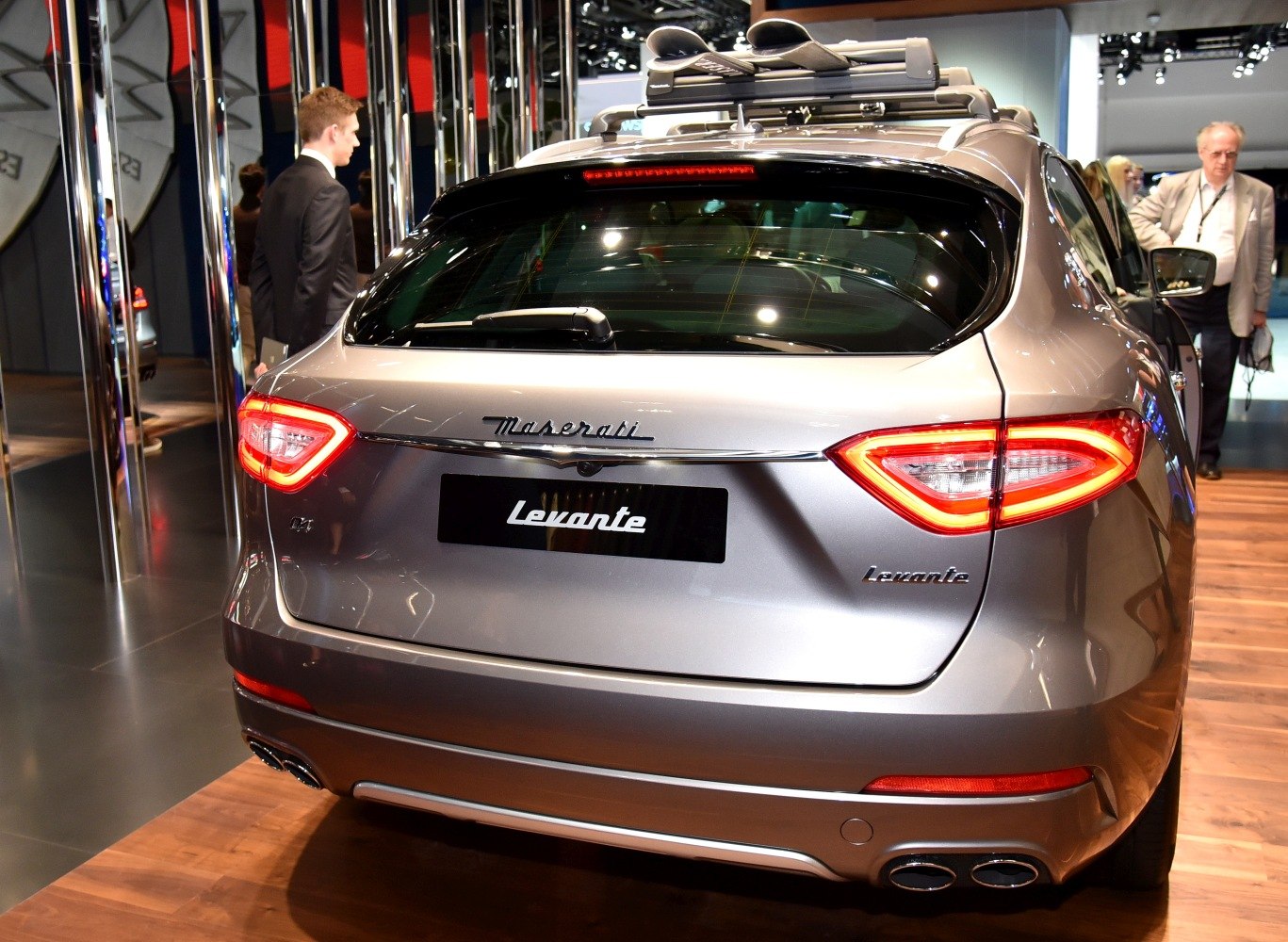 Rear view with distinctive tail lights and quad exhaust pipes
