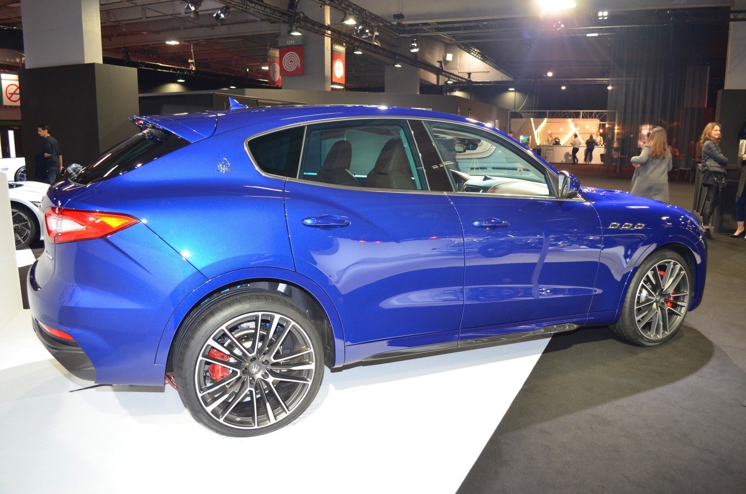 Blue SUV side view with alloy wheels and sporty design