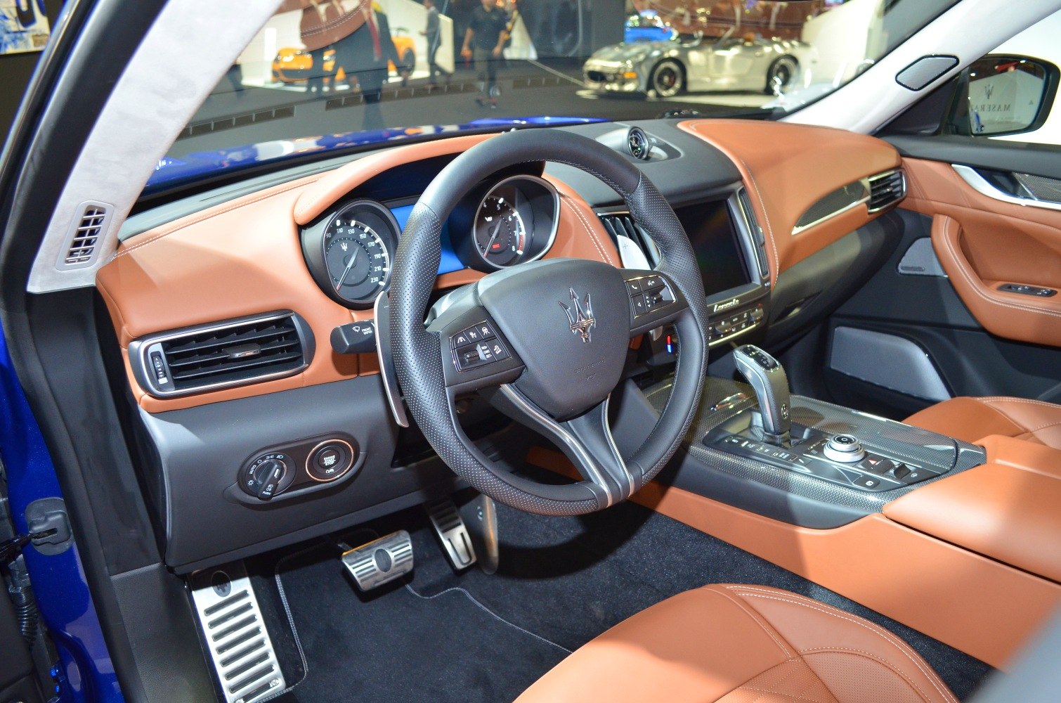 Luxury interior dashboard and steering wheel with leather upholstery