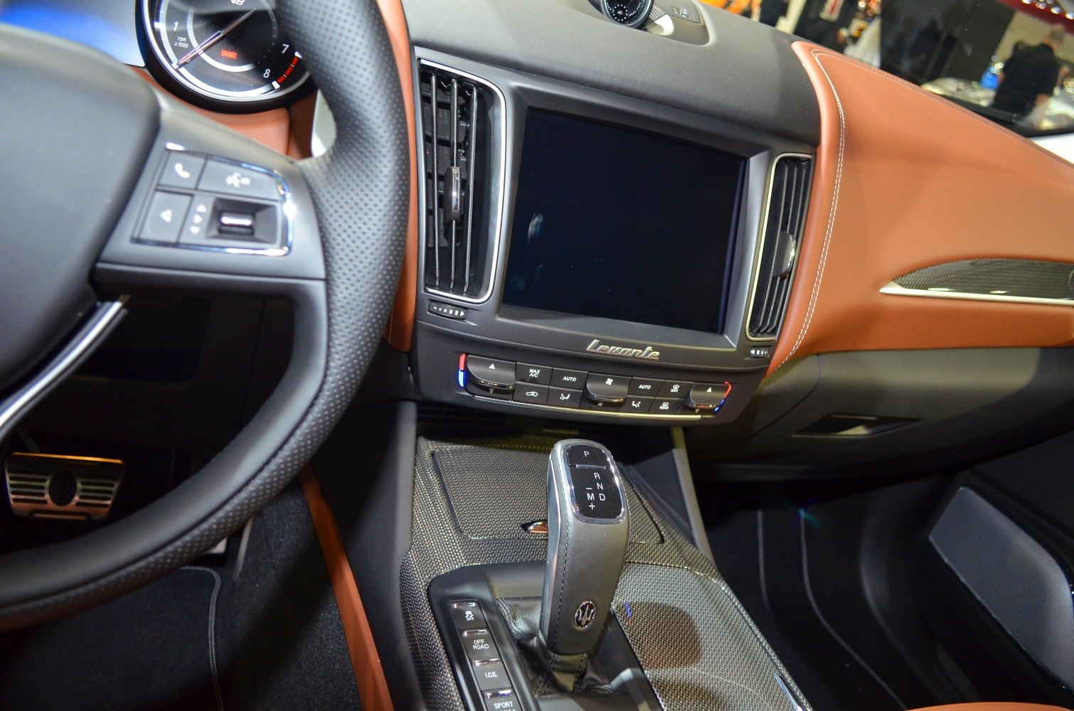 Dashboard, infotainment screen, and gear shift lever in luxury SUV interior