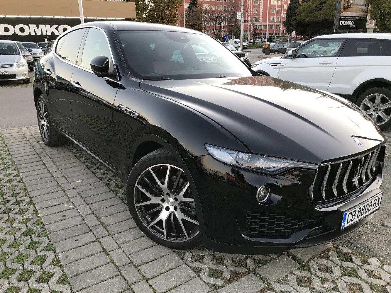 Front view of luxury SUV with LED headlights and vertical grille