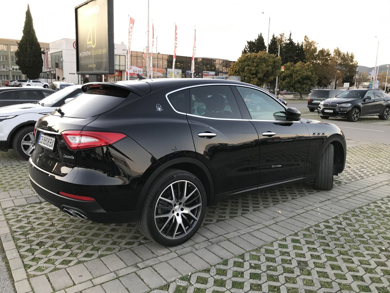 Black SUV rear side profile with distinct alloy wheels.