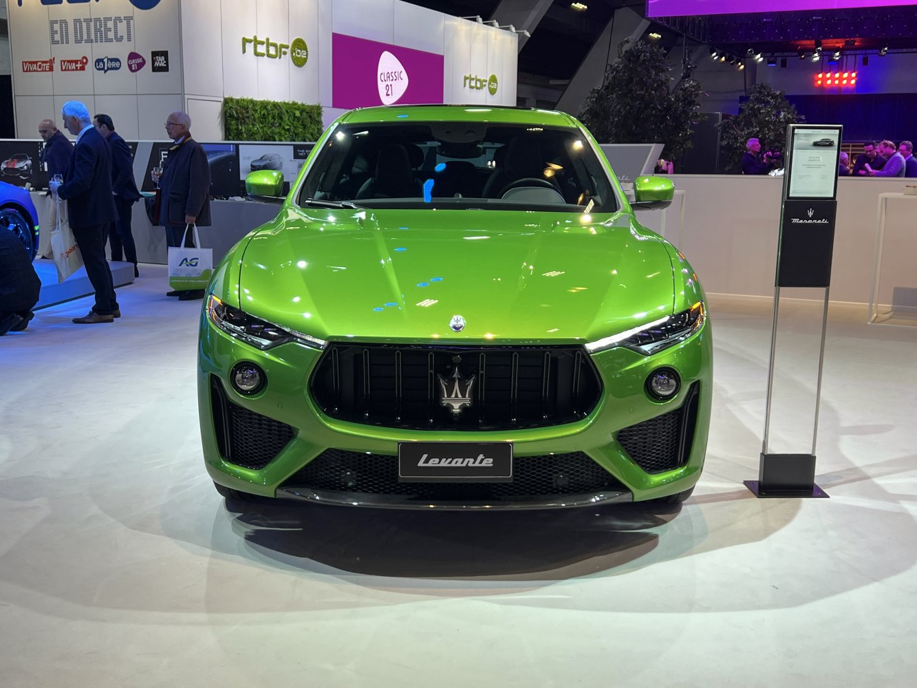 Front view with aggressive grille and sleek headlights of high-end SUV