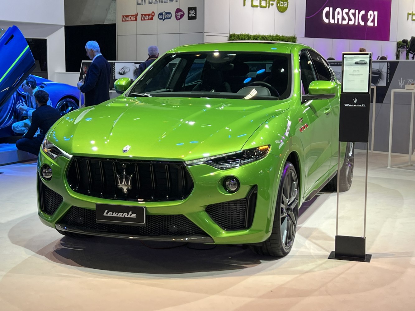 Bold front grille and sleek LED headlights in vibrant green.
