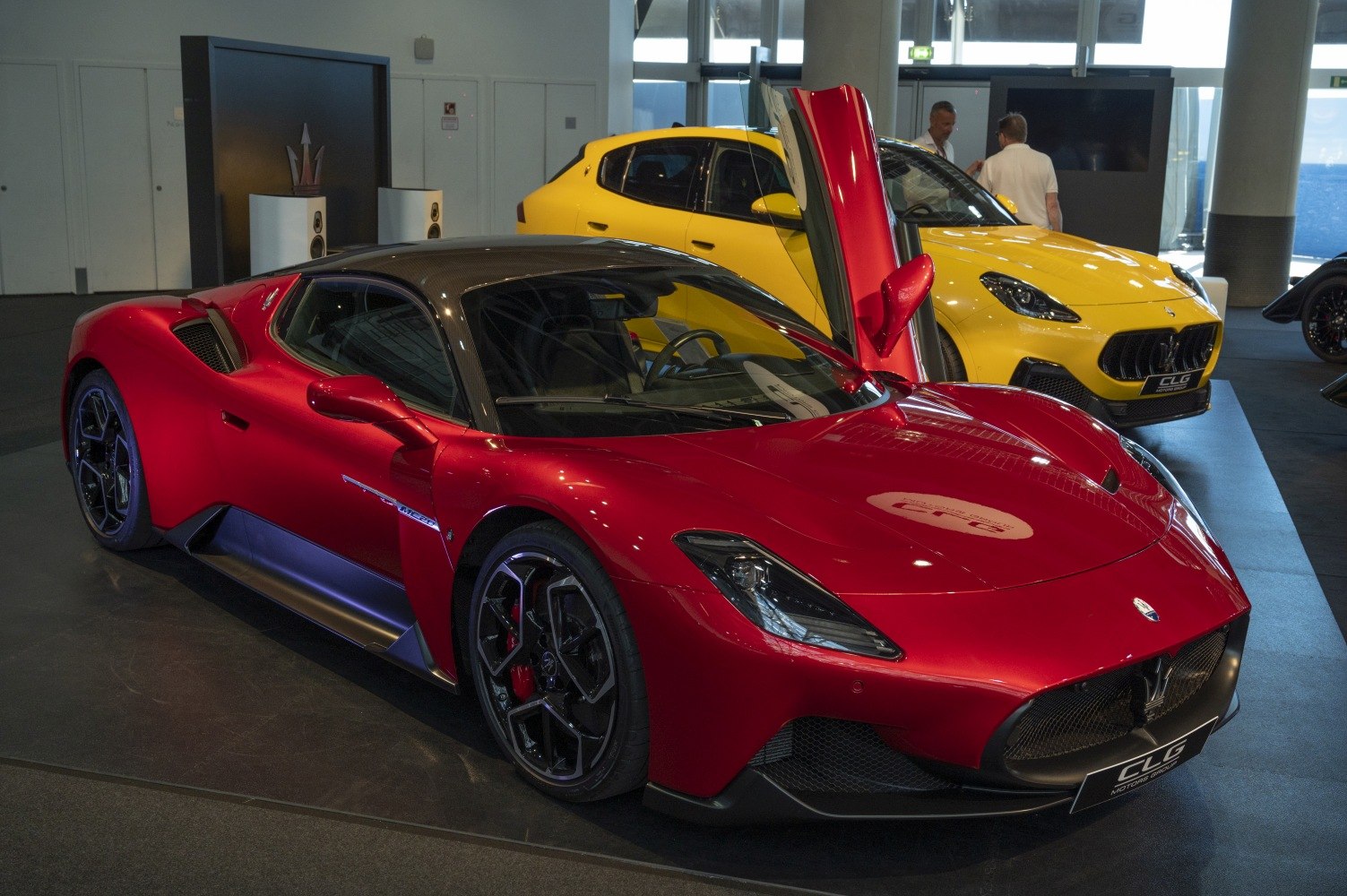 Red sports coupe with butterfly doors and carbon fiber roof