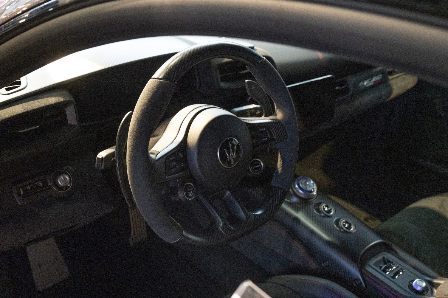 Steering wheel and carbon fiber center console with paddle shifters