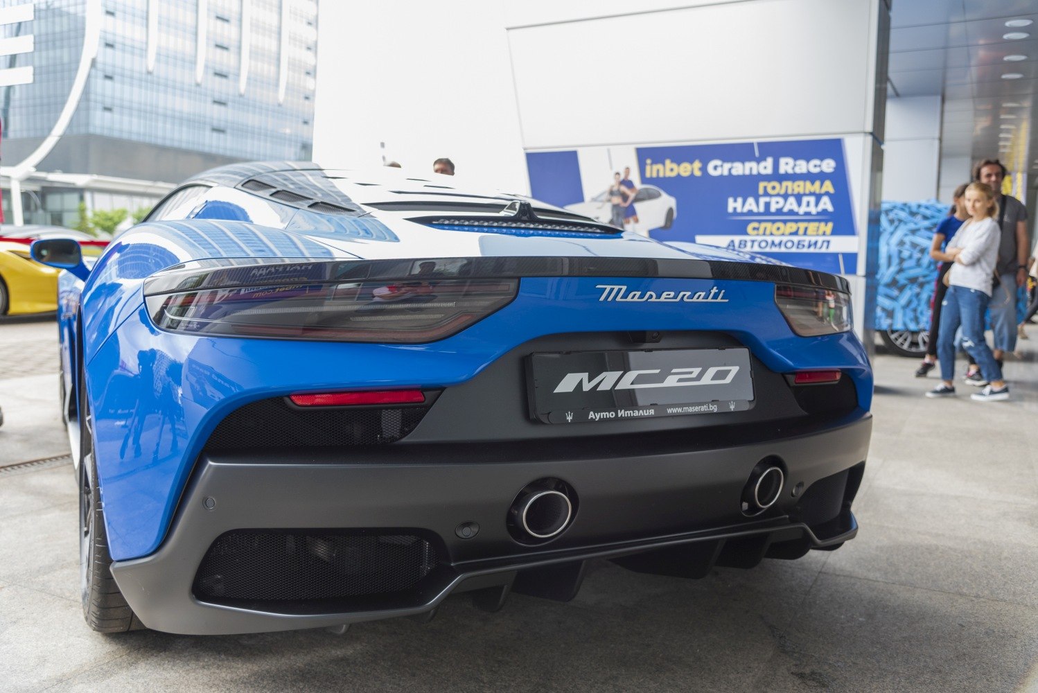 Rear view of sports car with sleek taillights and dual exhaust outlets