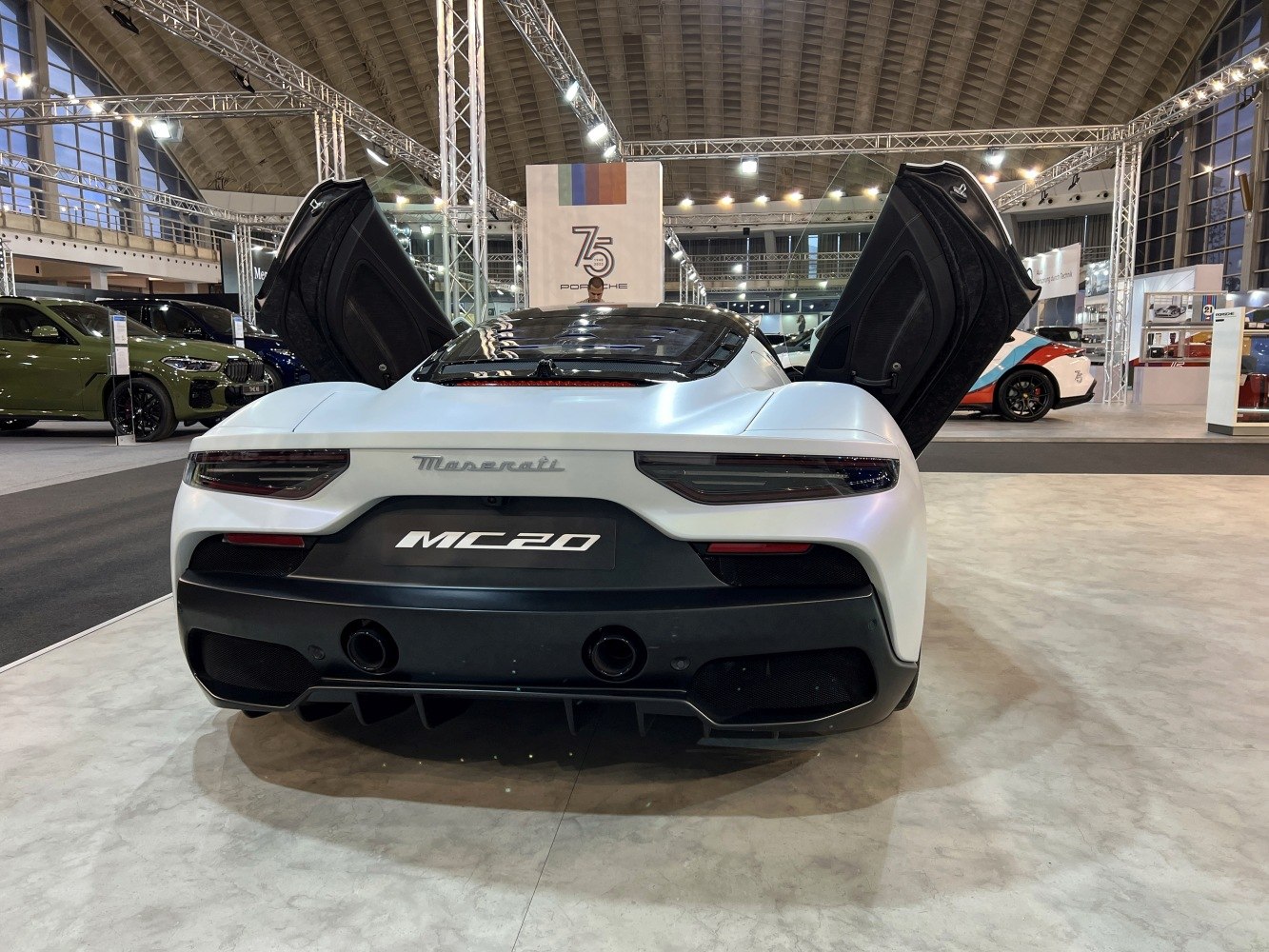 Rear view of sports car with butterfly doors open