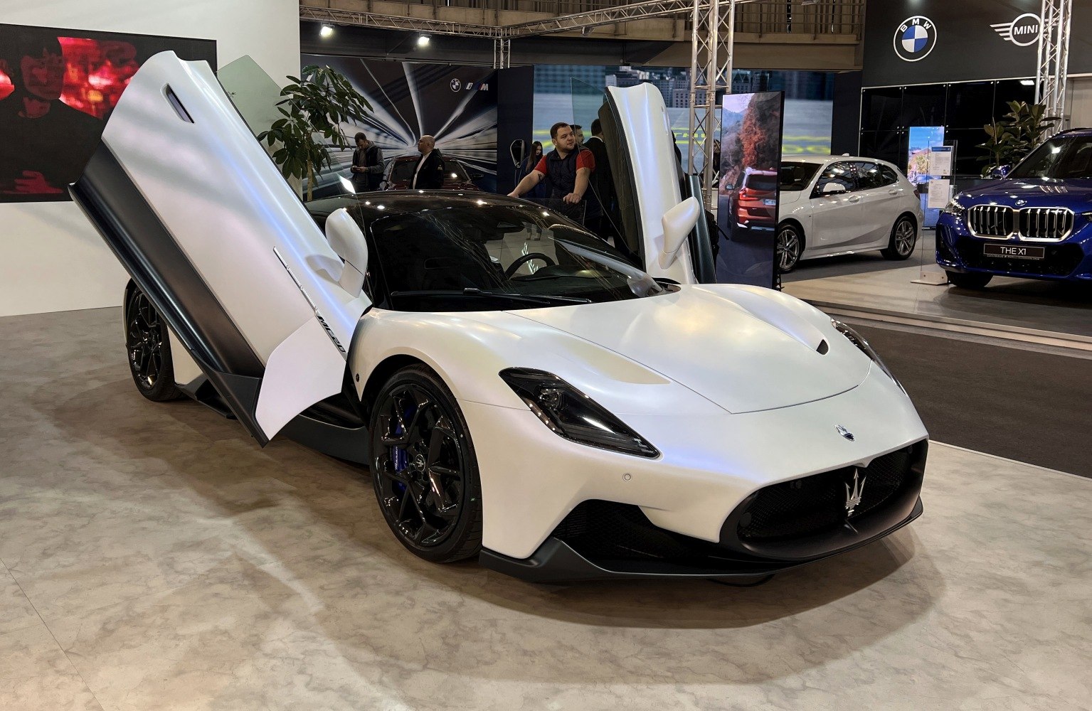 White sports car with butterfly doors and aerodynamic body