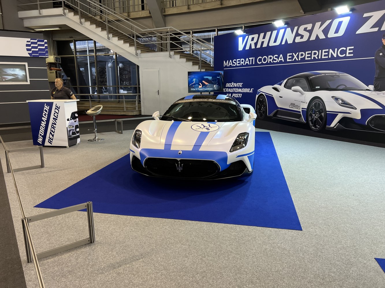 Front view of sports car with racing stripes and aerodynamic design