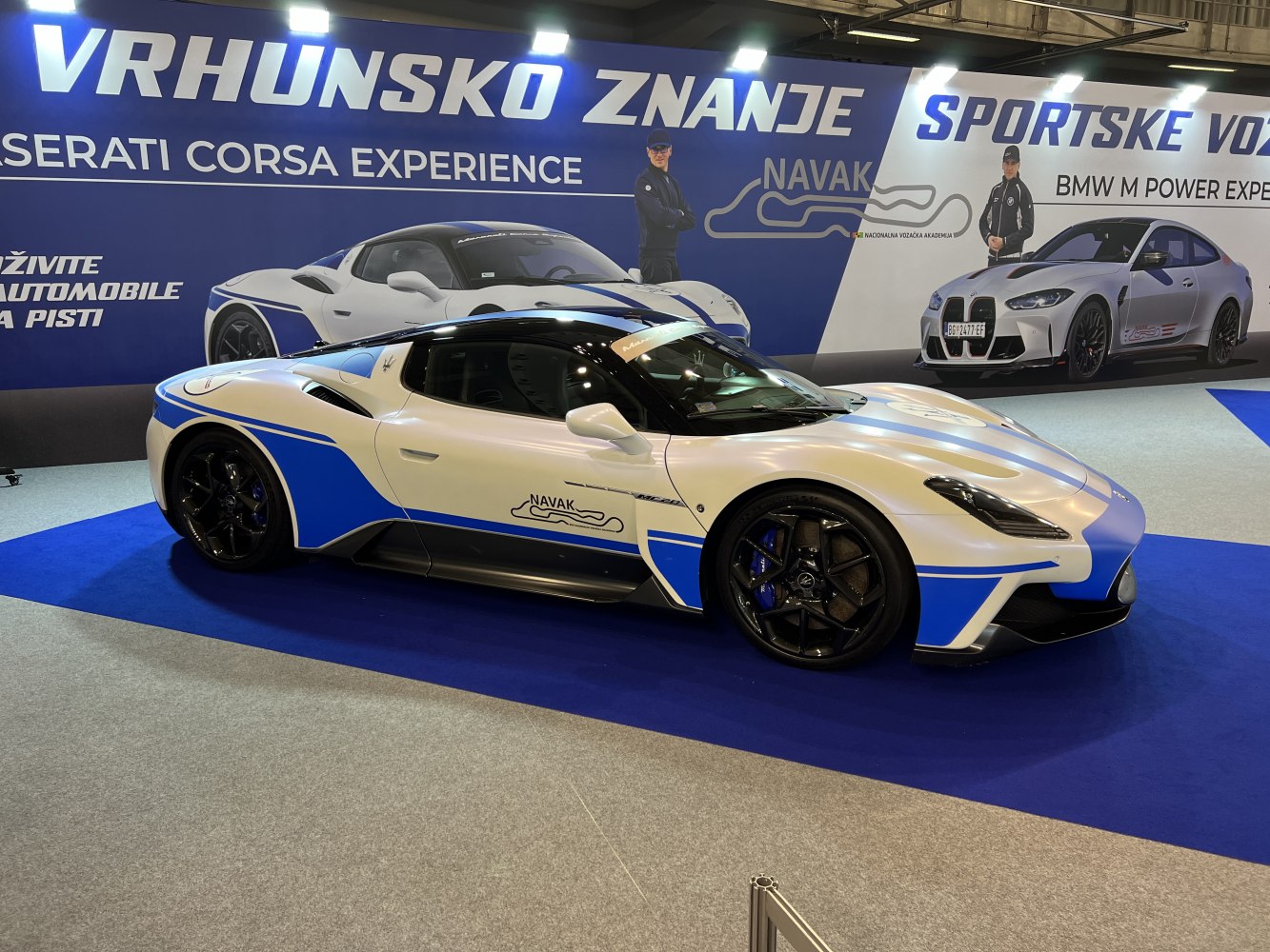 Racing-style Maserati MC20 with aerodynamic body and blue-white paint